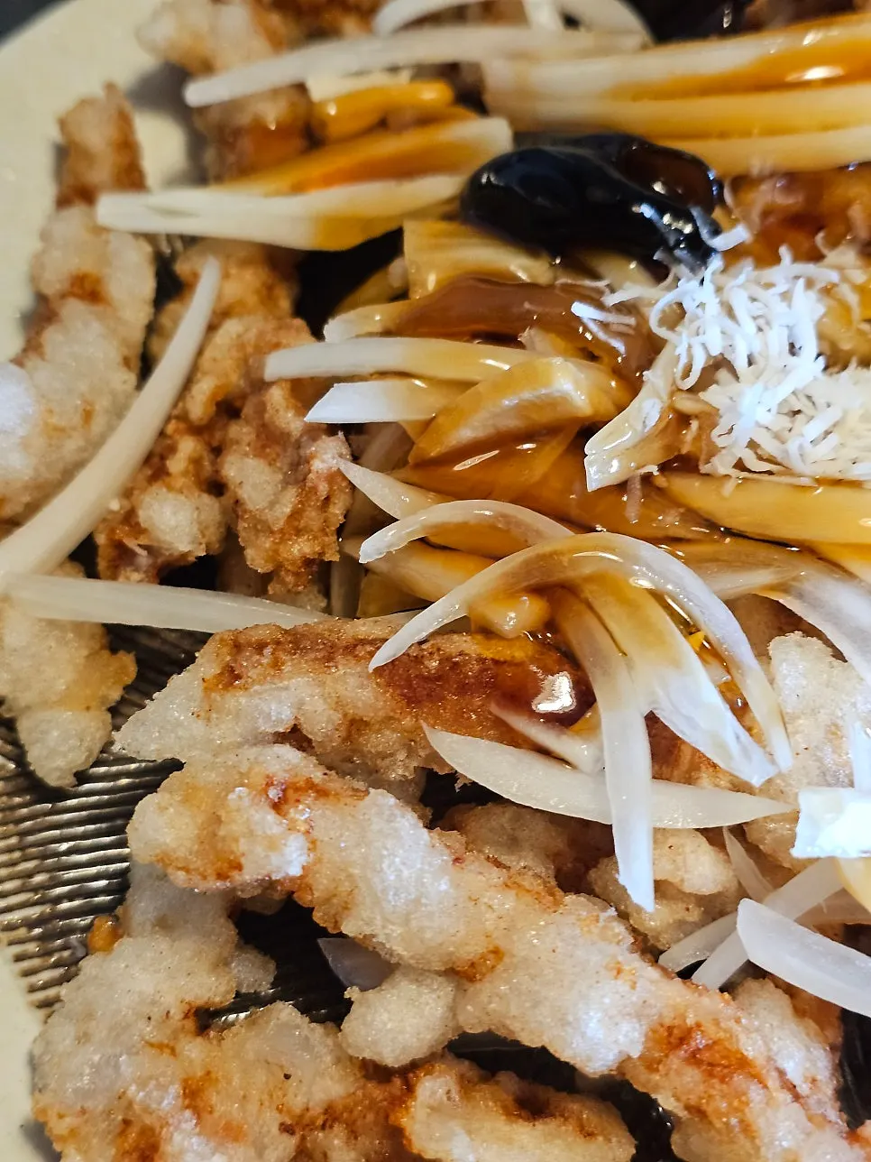 Close-up of a crispy piece of tangsuyuk