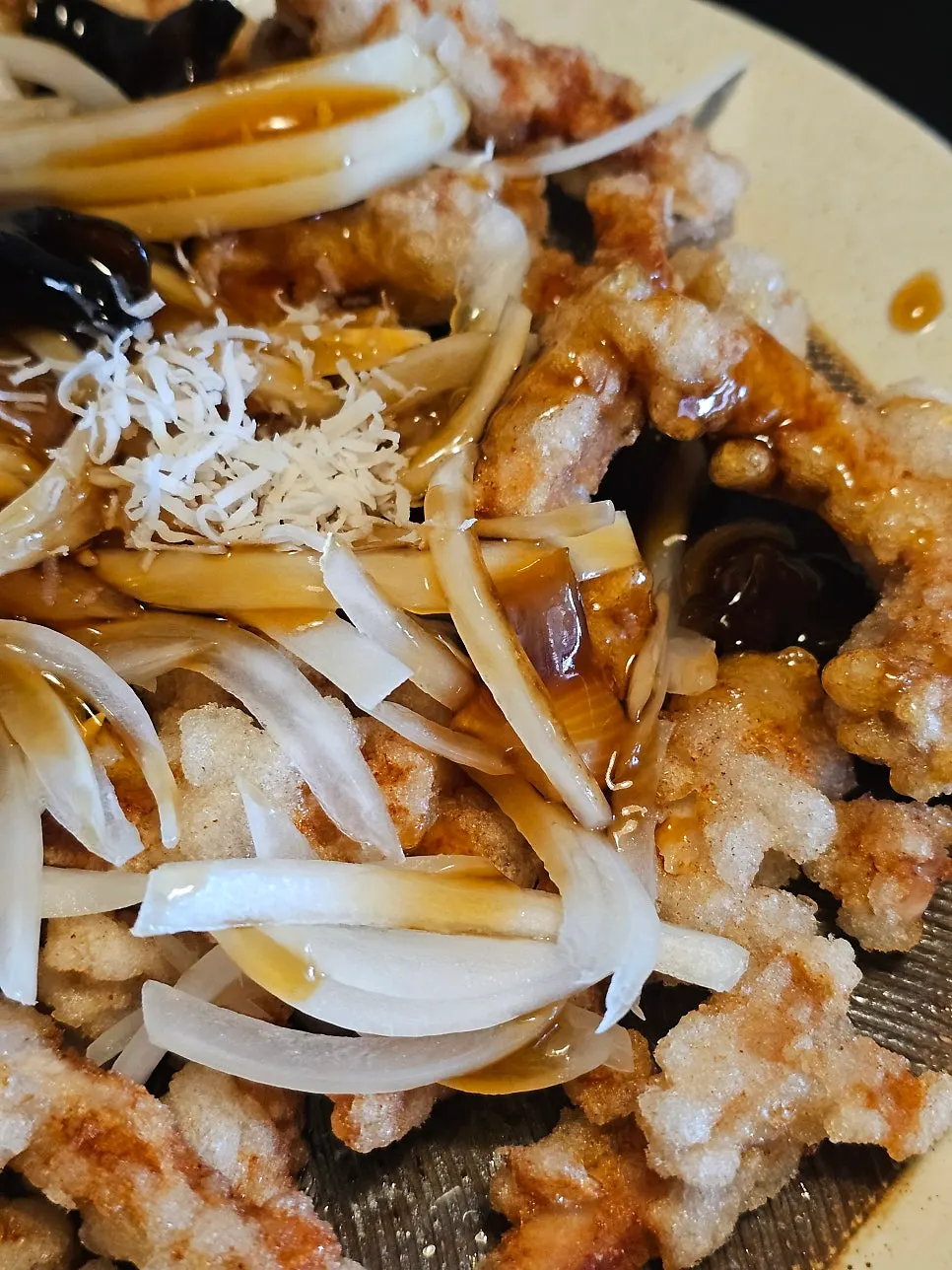 Tangsuyuk dipped in sweet and sour black vinegar sauce