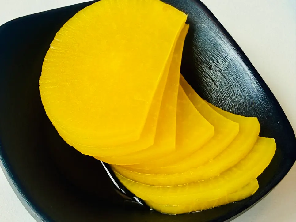 Side dishes of pickled radish and jjasai