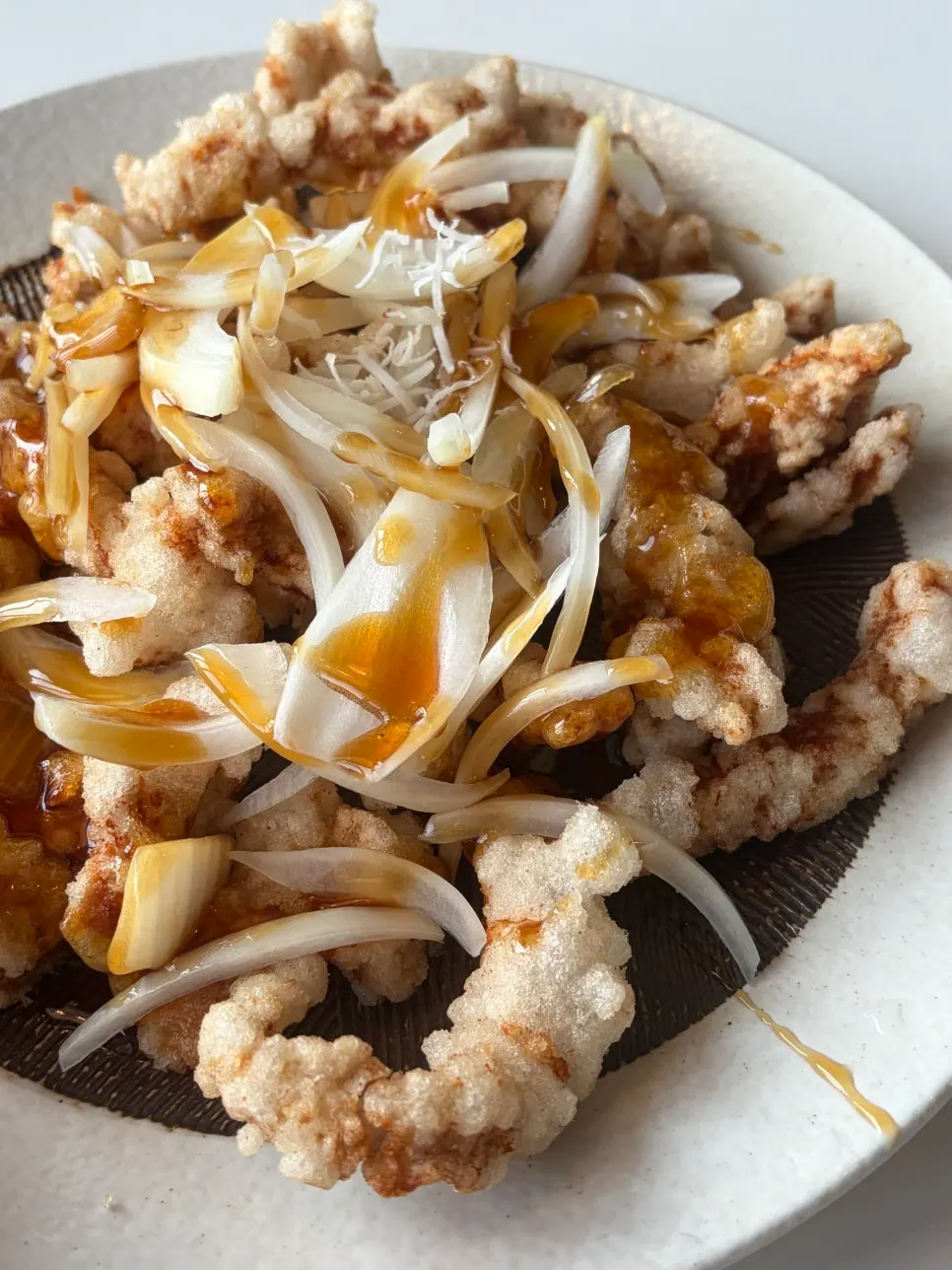 A plate of small black vinegar pork tangsuyuk