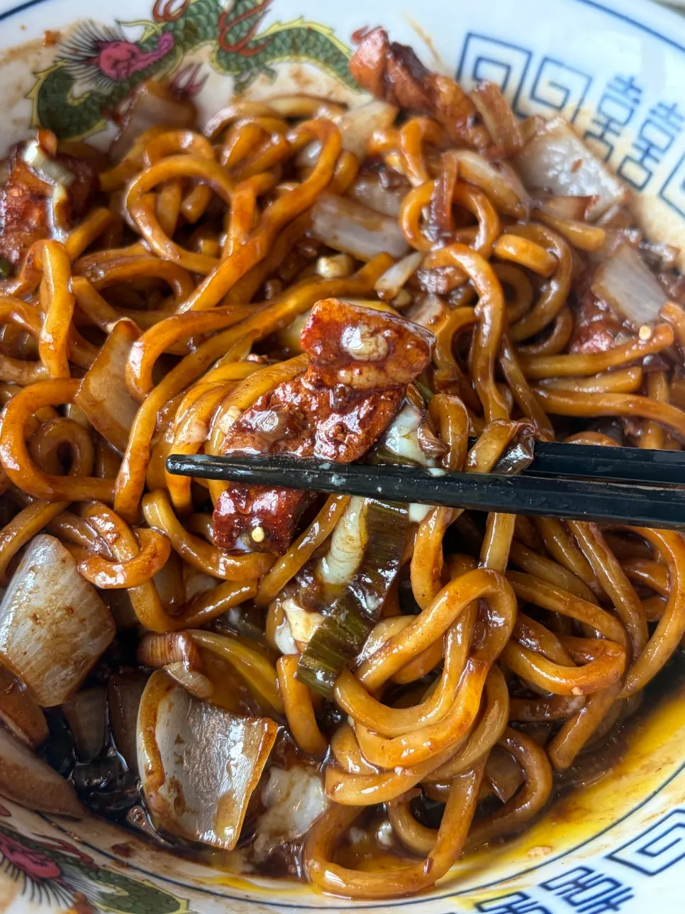 Jajangmyeon noodles mixed with the burst poached egg