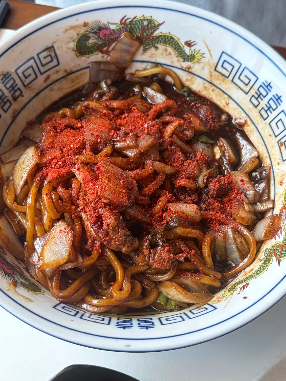 Jajangmyeon topped generously with red pepper flakes