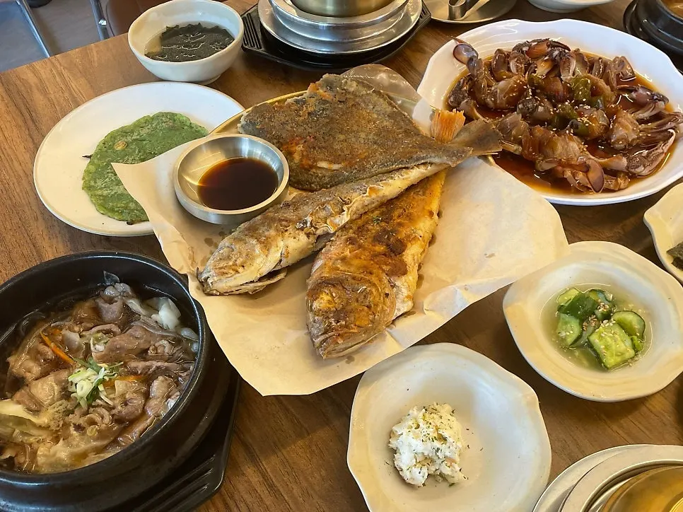 Full spread of grilled fish trio and soy crab