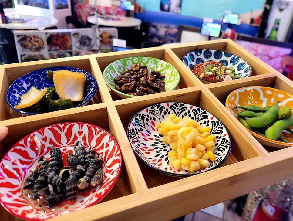 Colorful basic side dishes served on unique plates