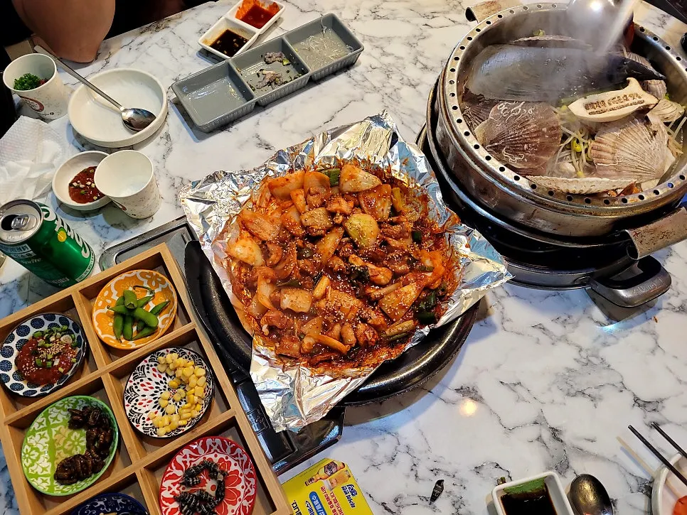 Full table spread of seasoned hagfish and clam stew