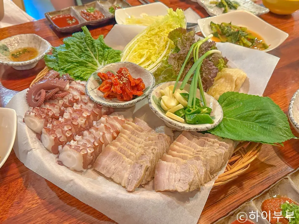 Makgeolli glass and side dishes on the table