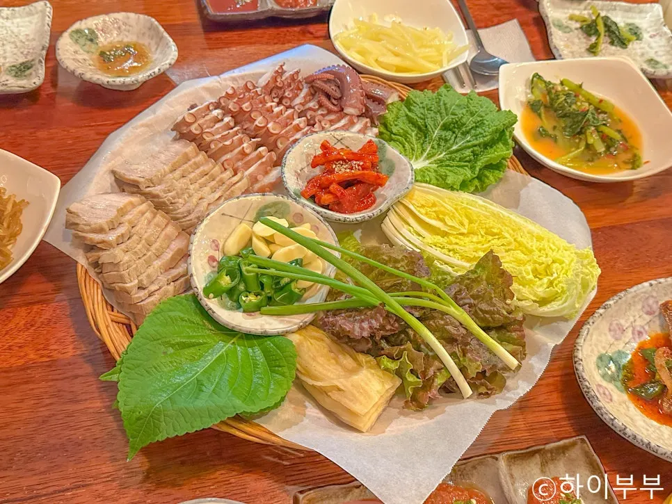 Bibim guksu topped with beef jeon and vegetables