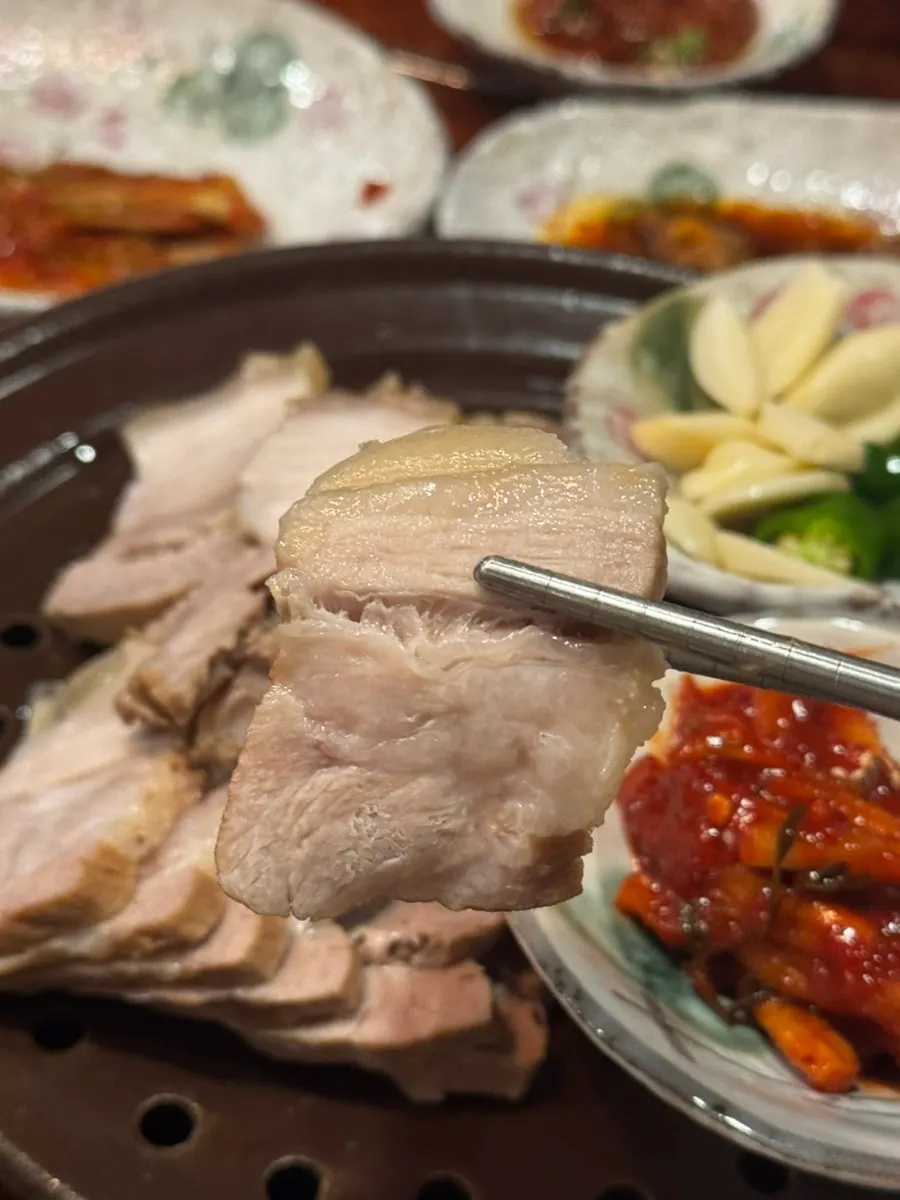 A piece of suyuk placed on a cabbage wrap