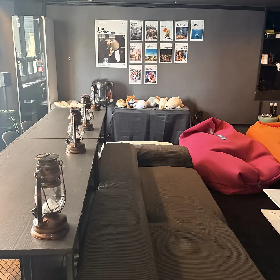 Interior of room 801 with recliner sofa and bean bags