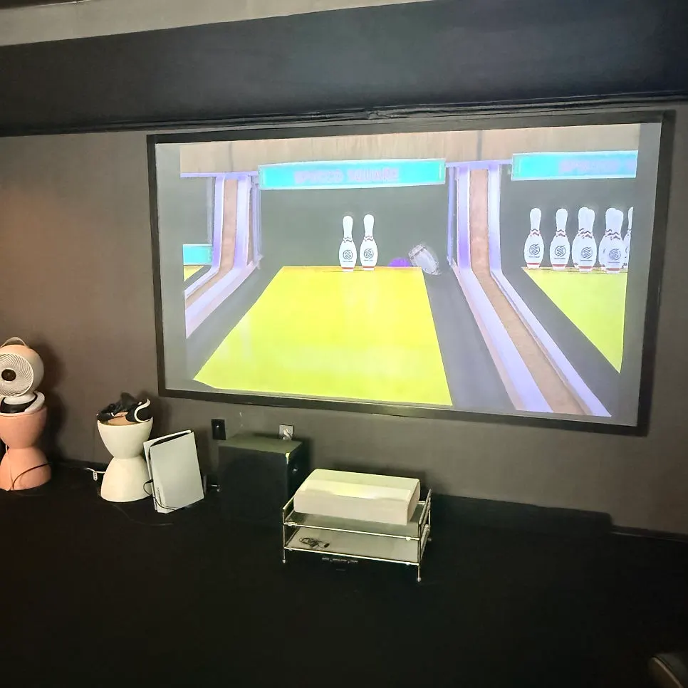 Playing Mario Kart on the big screen with the curtains closed