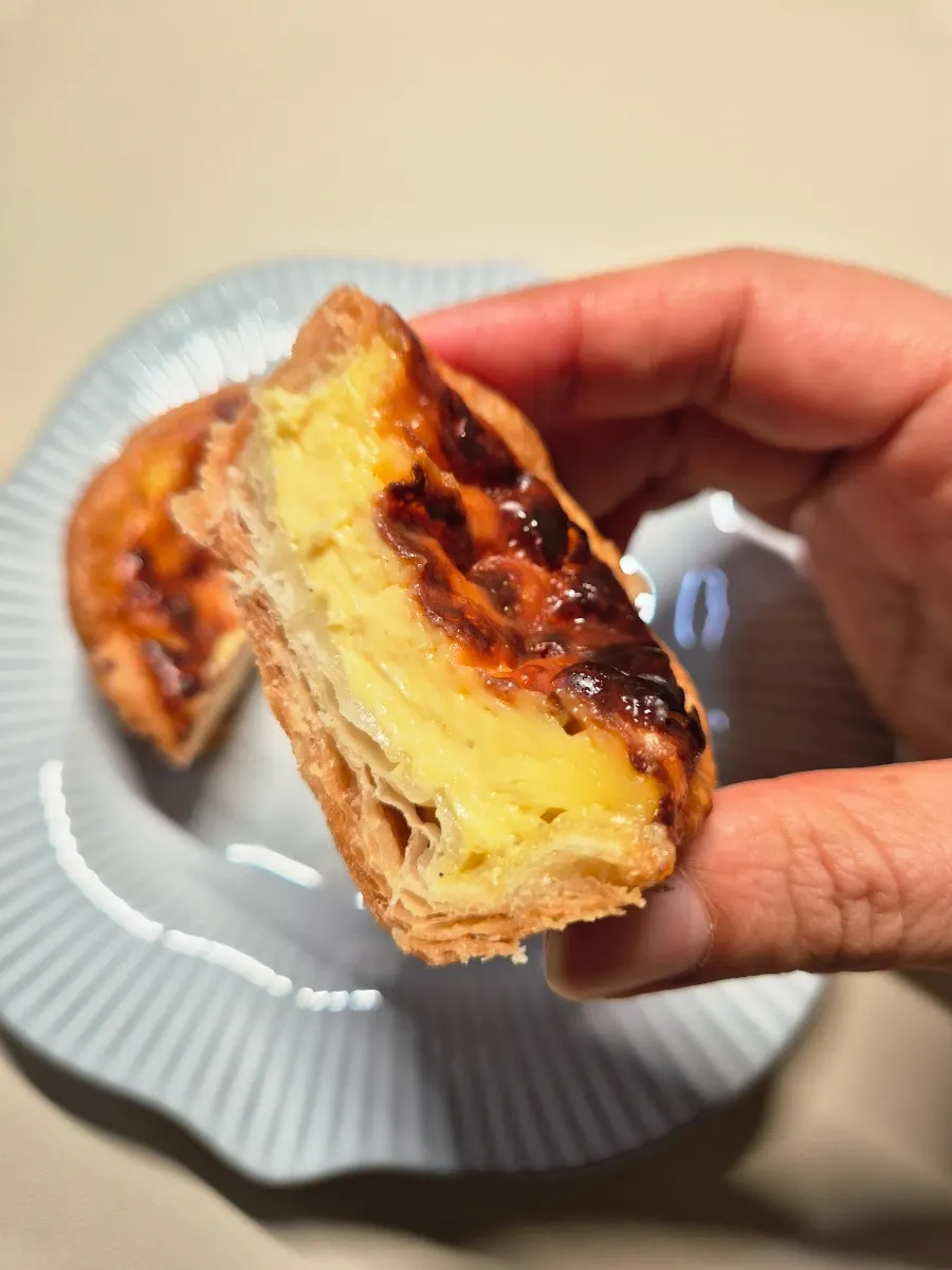 Cross-section of the egg tart showing custard filling