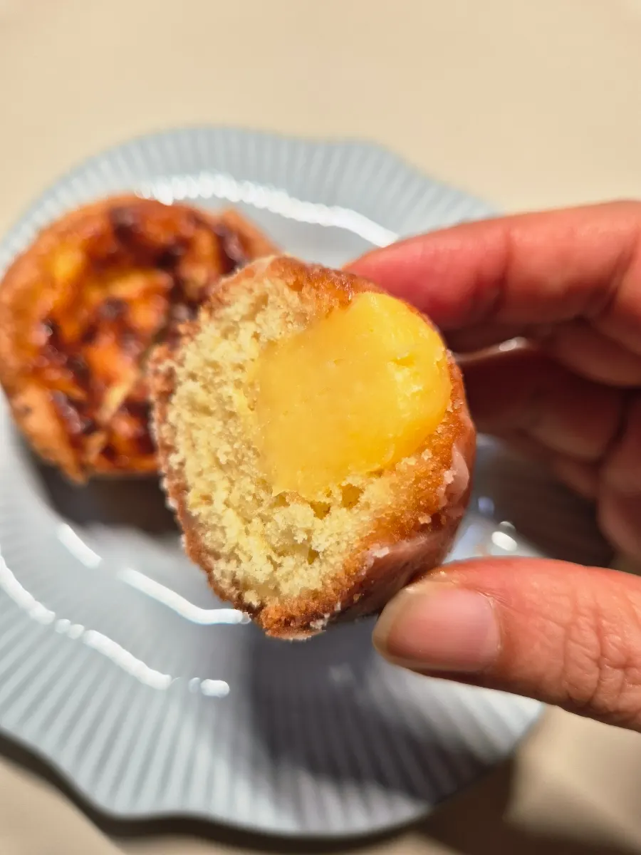 Inside of the lemon financier with a crisp exterior