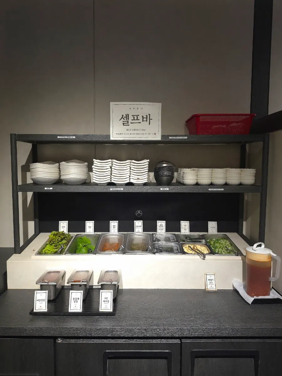 Table setting with ssam vegetables and side dishes