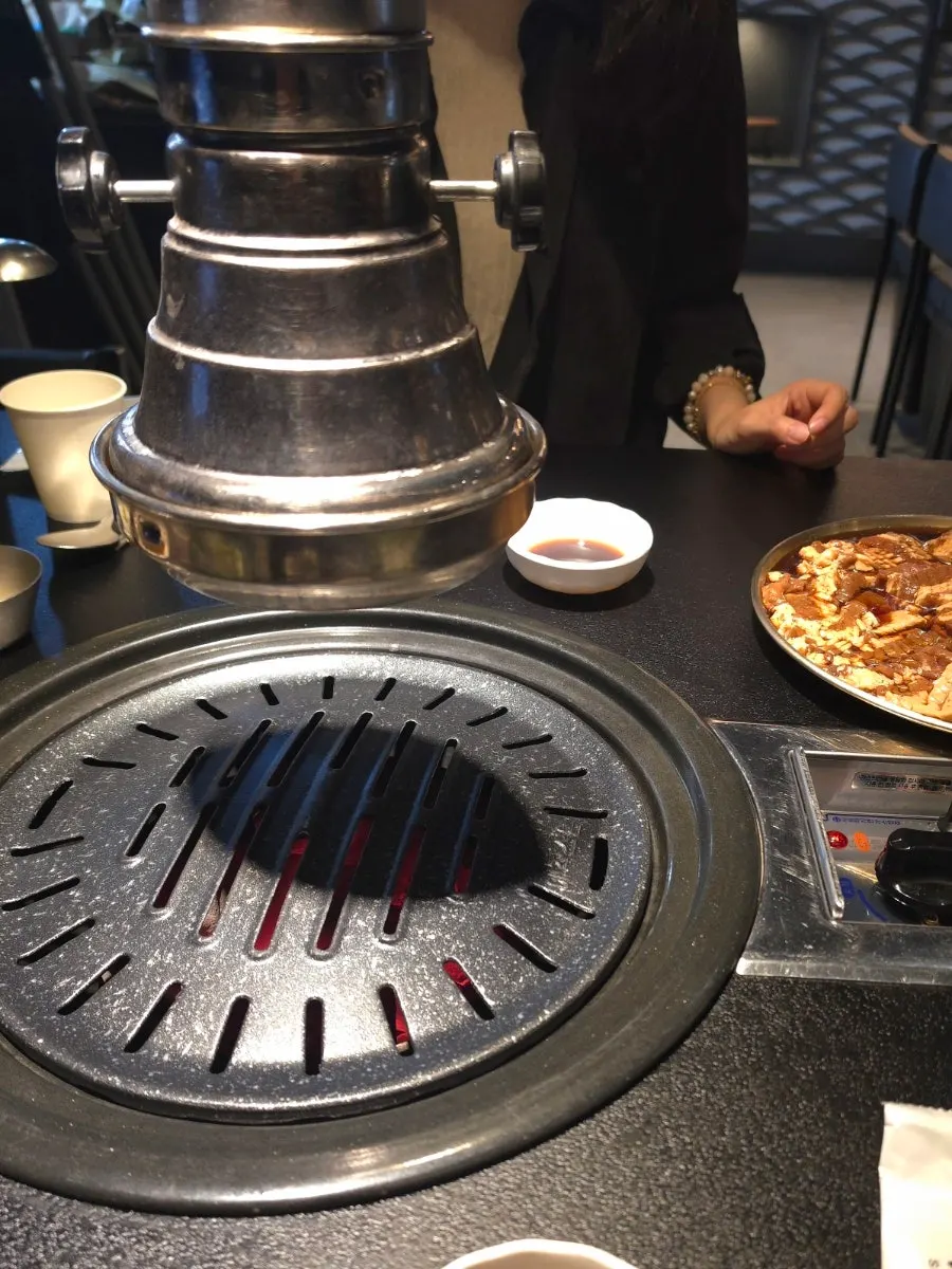 Charcoal grill set on a Seokok Galbi table