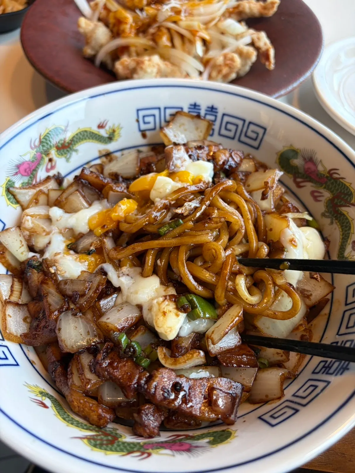 Vertical photo of Chinese dishes and seafood jjamppong