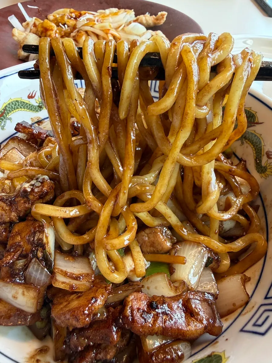 Vertical photo of a private-room Chinese dining gathering