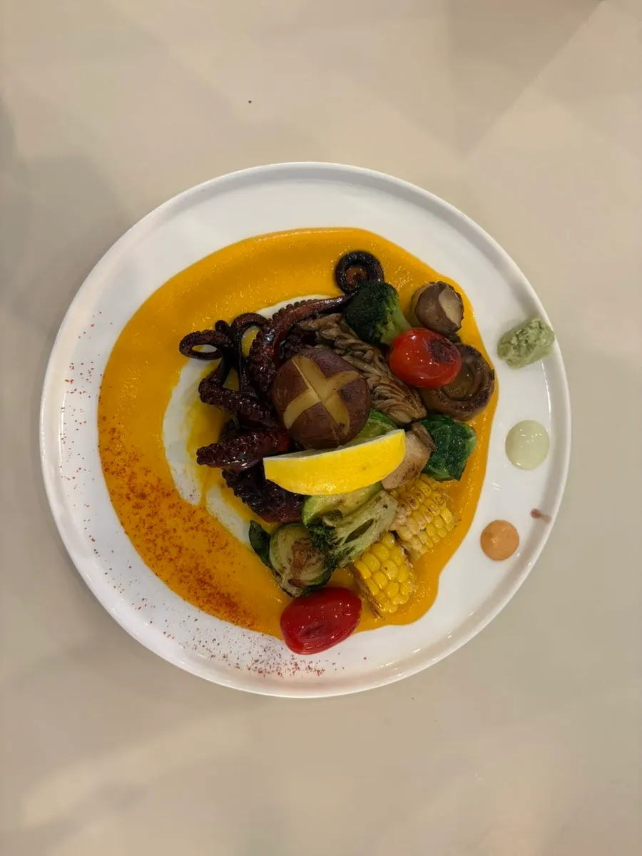 Stone octopus steak served with carrot purée