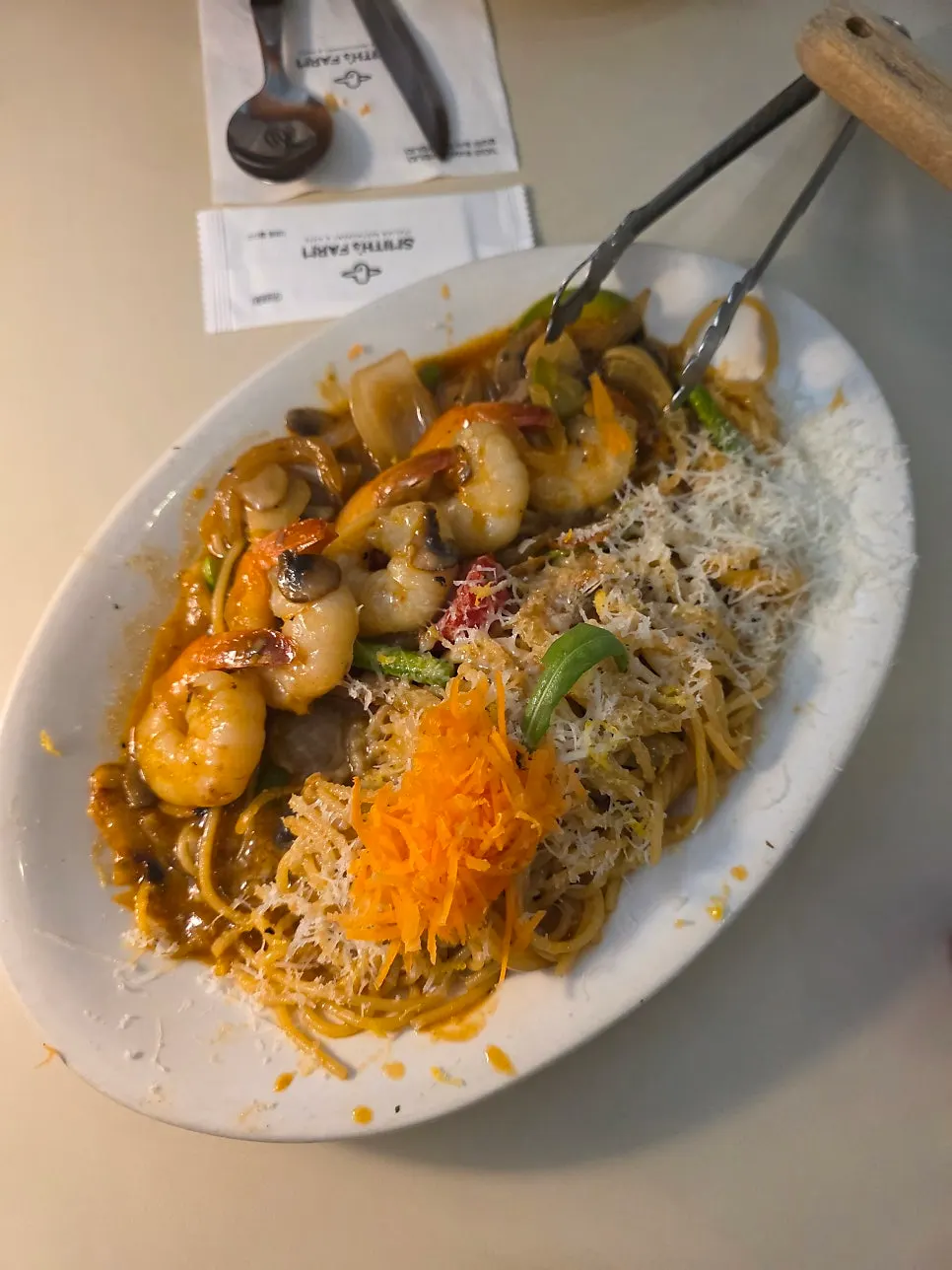 Shrimp oil pasta topped with shrimp