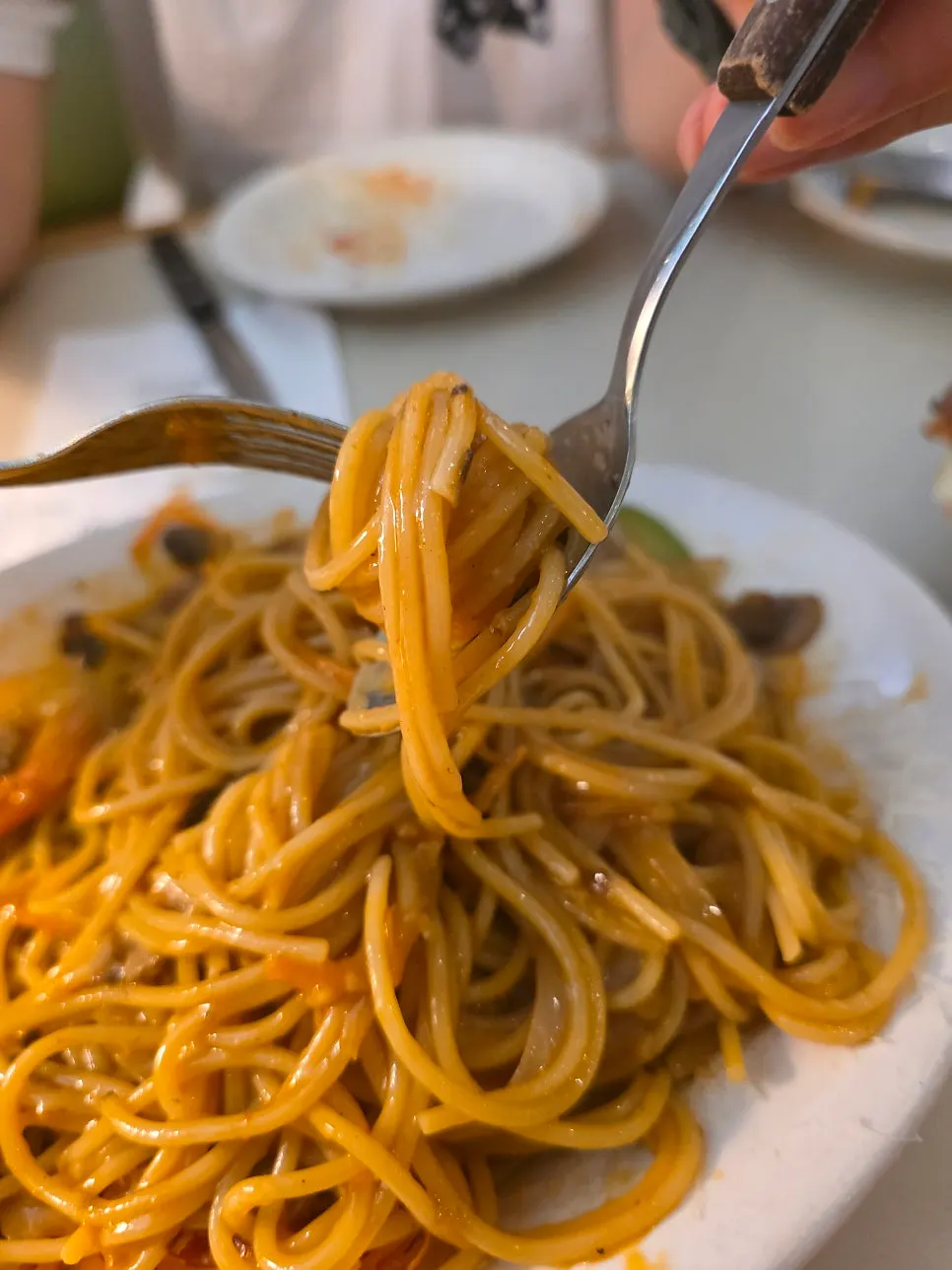 Noodles lifted up from the oil pasta