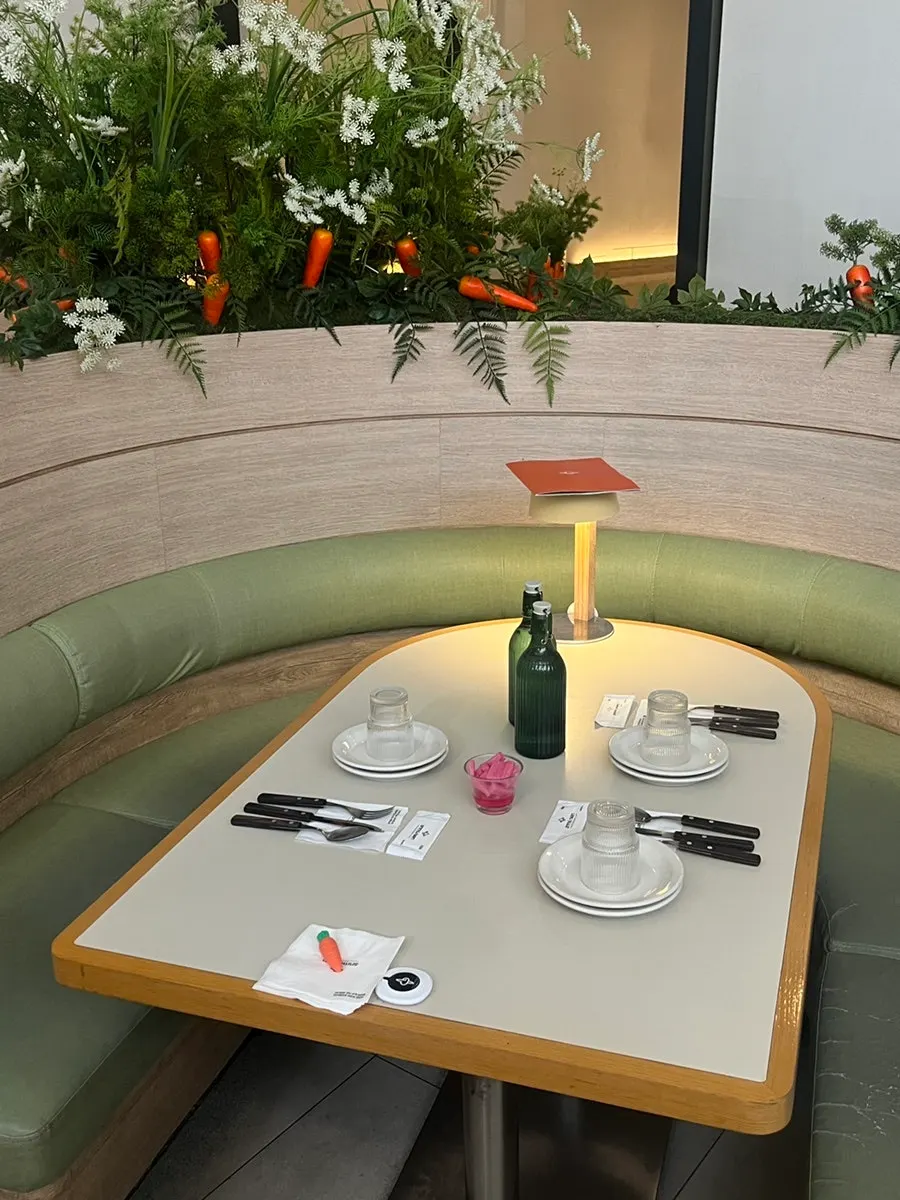 Curved sofa seating with a carrot prop