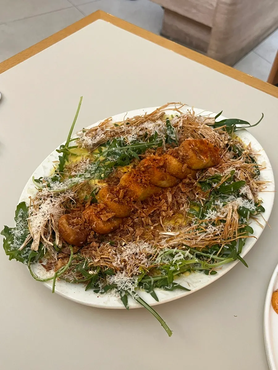 Pumpkin sweet potato gnocchi topped with arugula