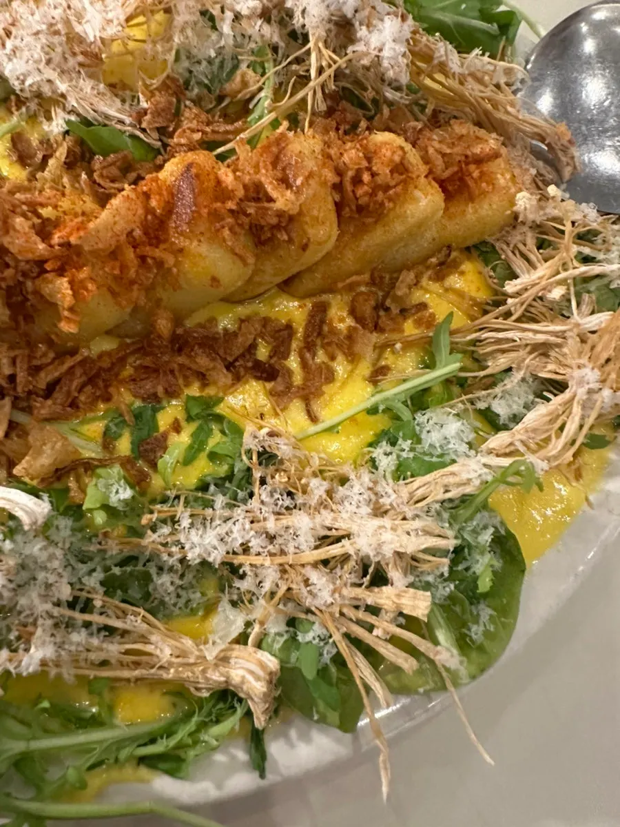 Octopus steak with purée sauce and corn
