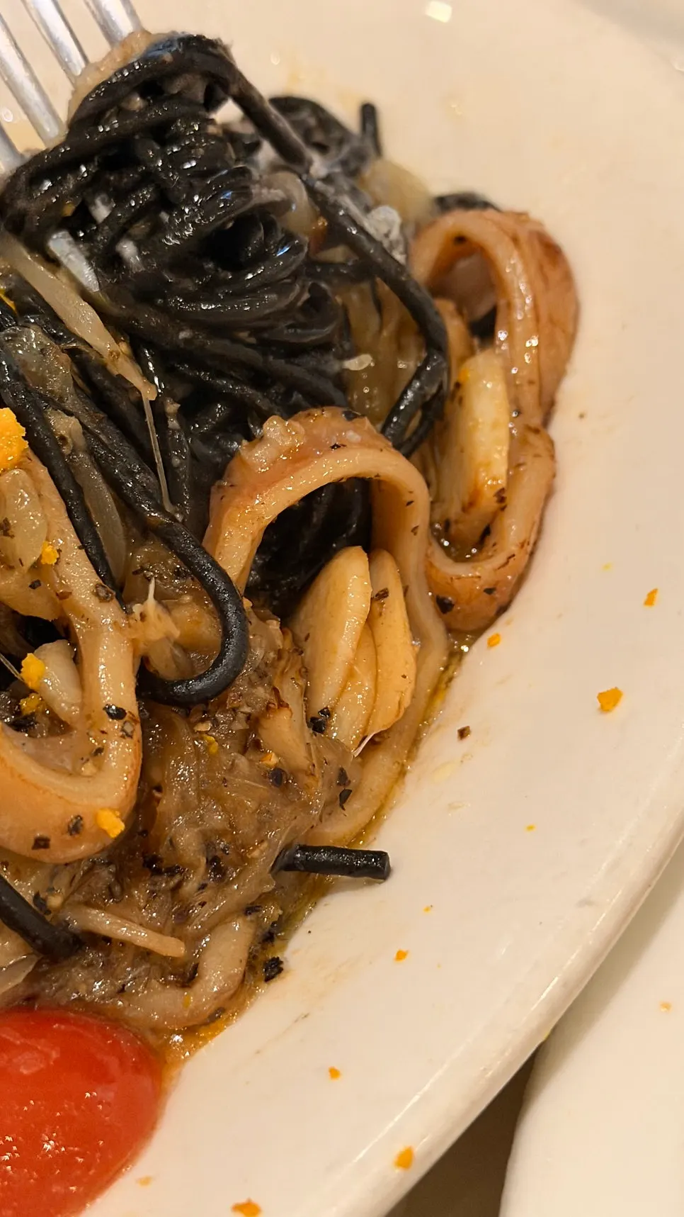 Squid-ink pasta topped with octopus and squid