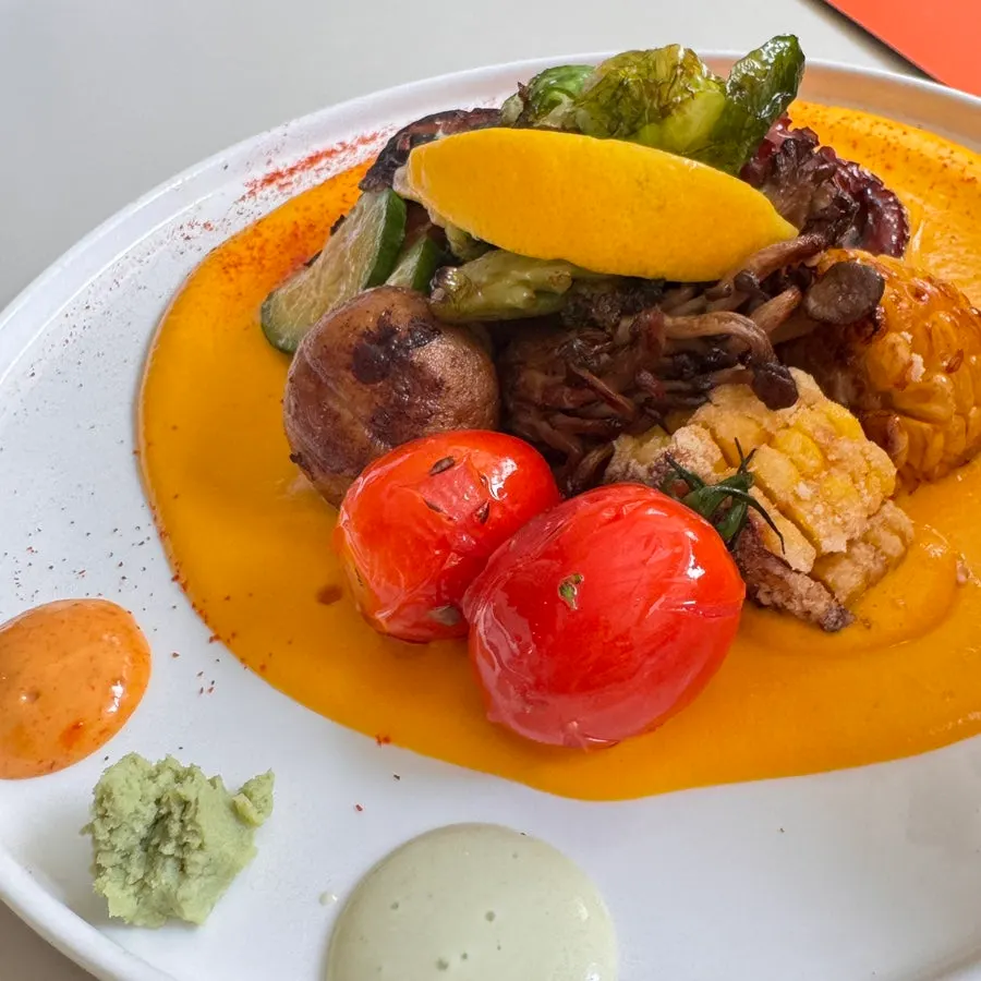 Close-up of stone octopus steak and pumpkin purée