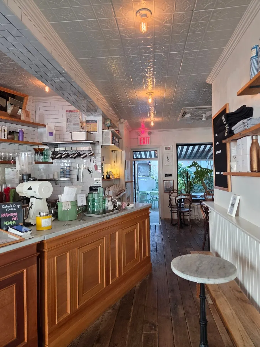 Café interior with white walls and wooden furnishings
