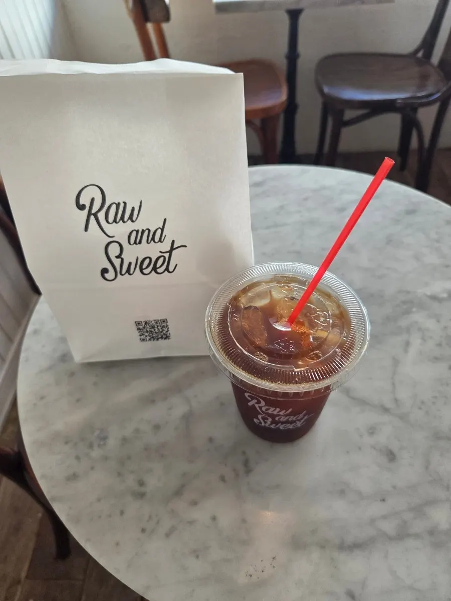 Takeout egg tart, baked goods, and decaf americano