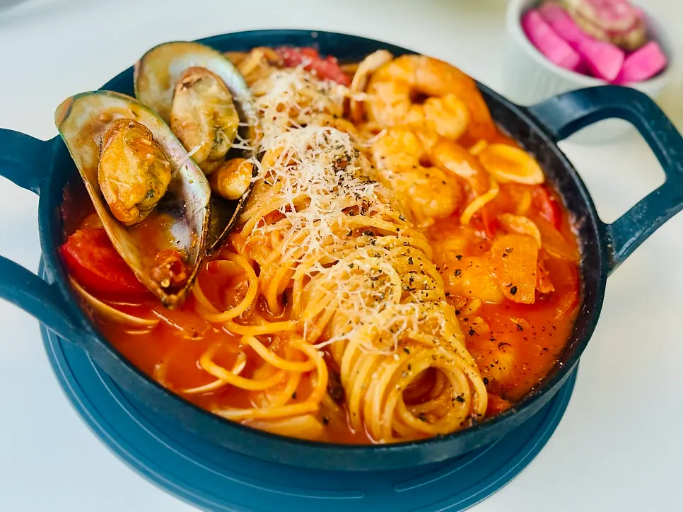 Seafood tomato ttukbaegi pasta