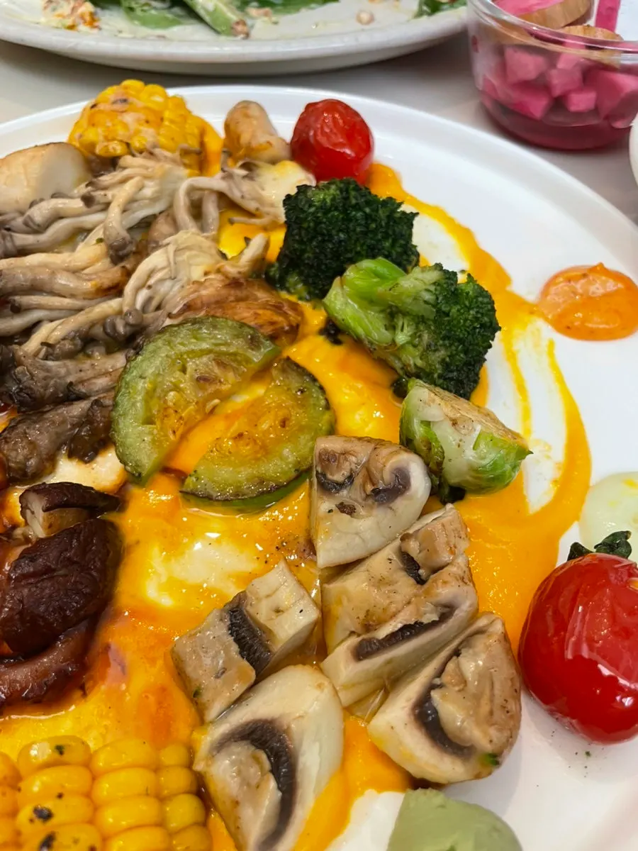Stone octopus steak plated over carrot purée