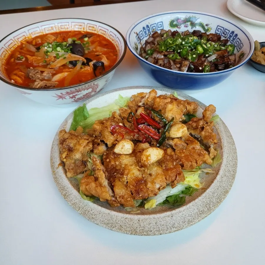 A full spread of ordered Chinese dishes
