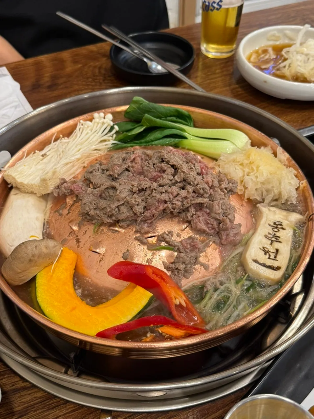 Table setting with drinks alongside the bulgogi
