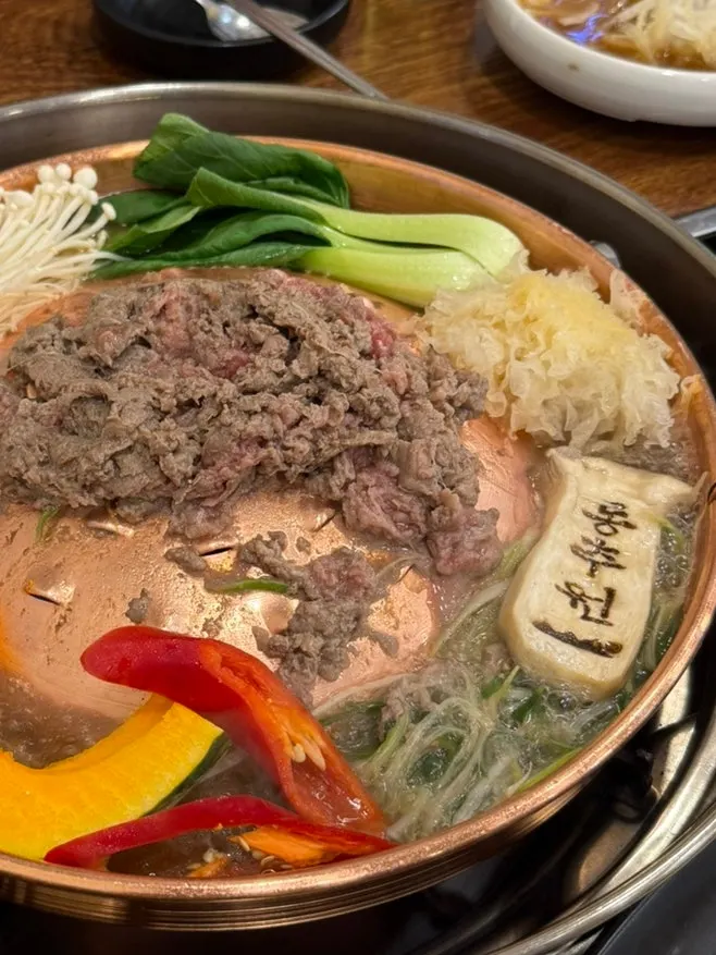 Bulgogi broth gently simmering in the pot