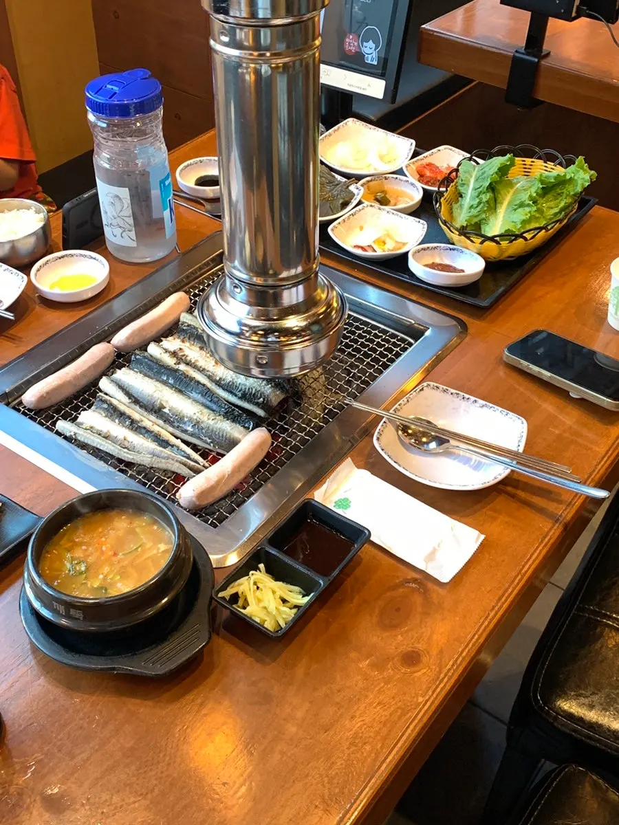 Staff preparing grilled eel