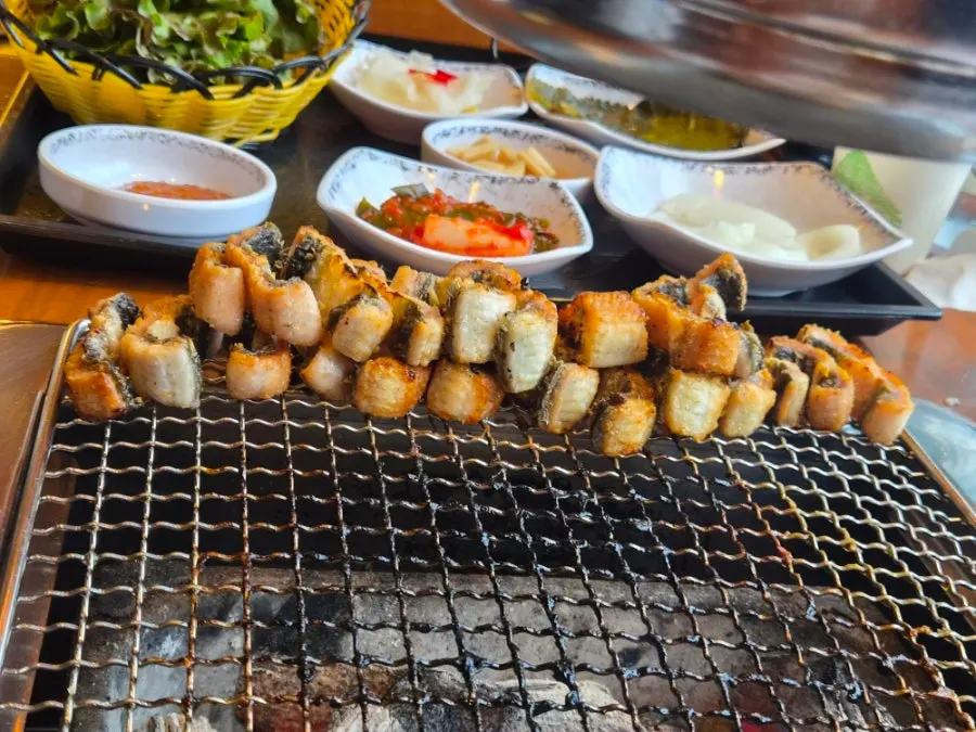 Neatly stacked grilled eel on the grill plate
