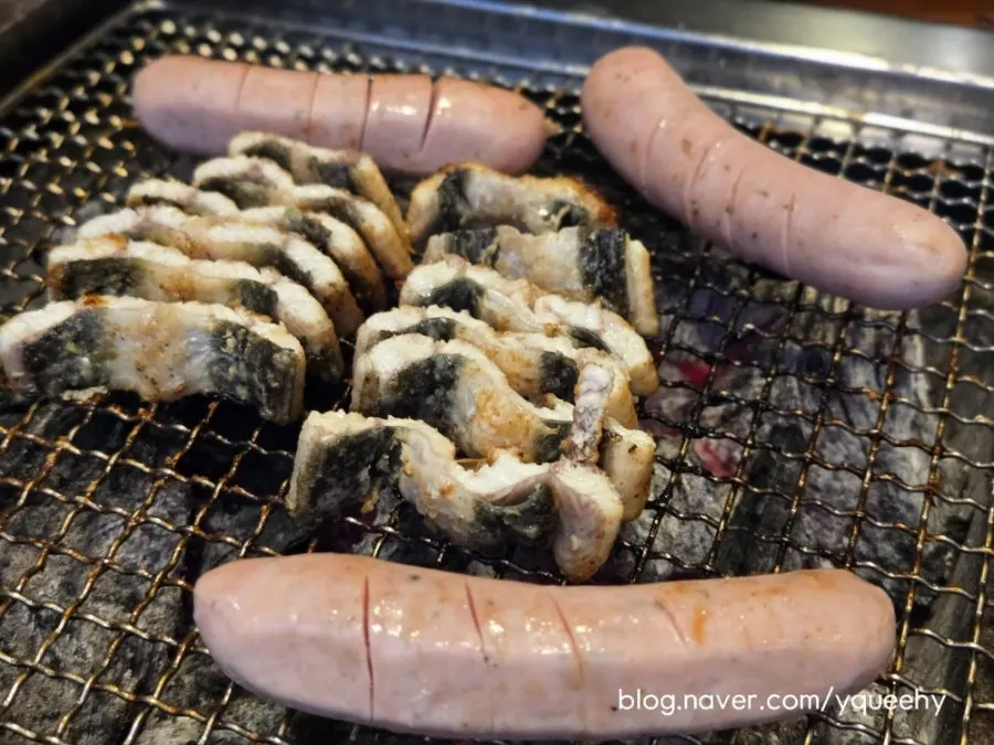 Plump sausage grilled by staff