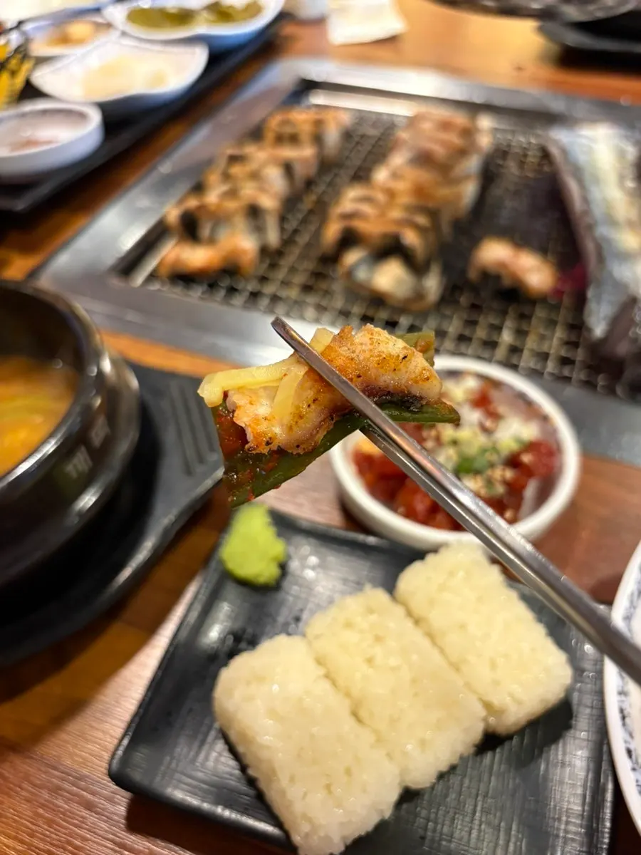 Glass of alcohol alongside the eel meal