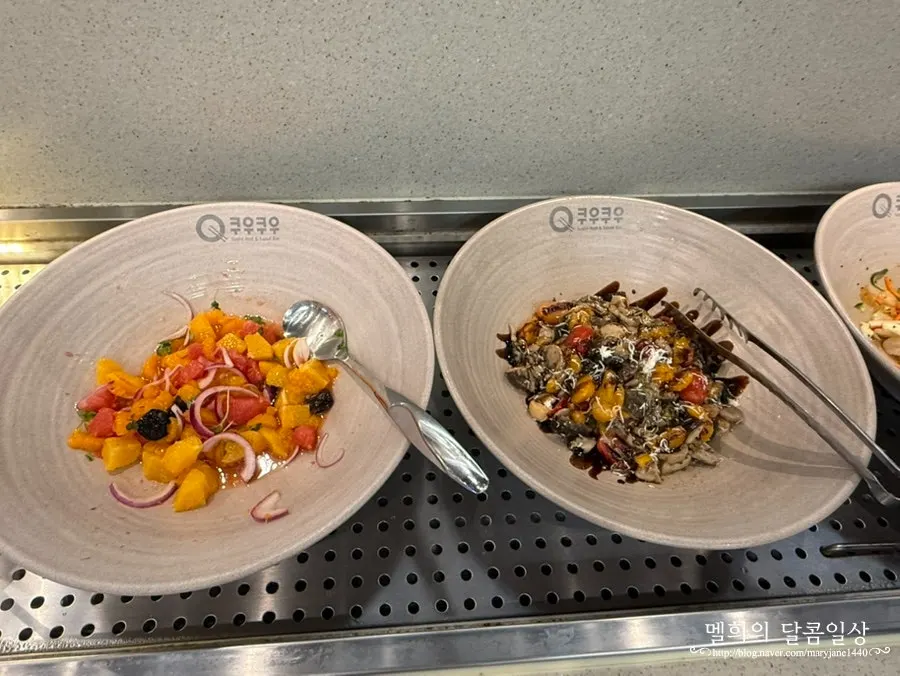 Salad selections with salmon, squash, and Cajun chicken
