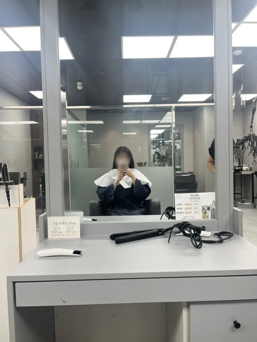 Wearing a gown before the dyeing begins