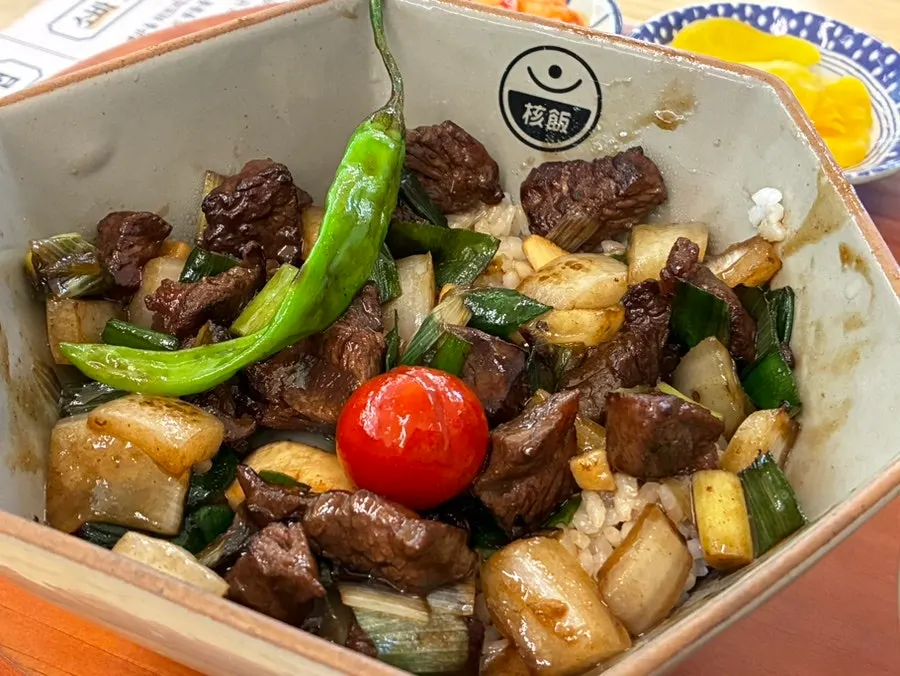 Cube steak rice bowl served with wasabi on the side