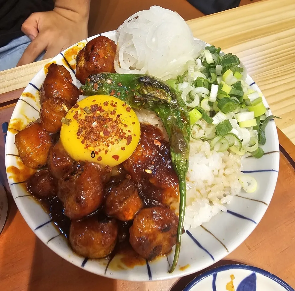 Rice bowls and ramen table setting at Hekbap Kkachisan Branch near Kkachisan Station