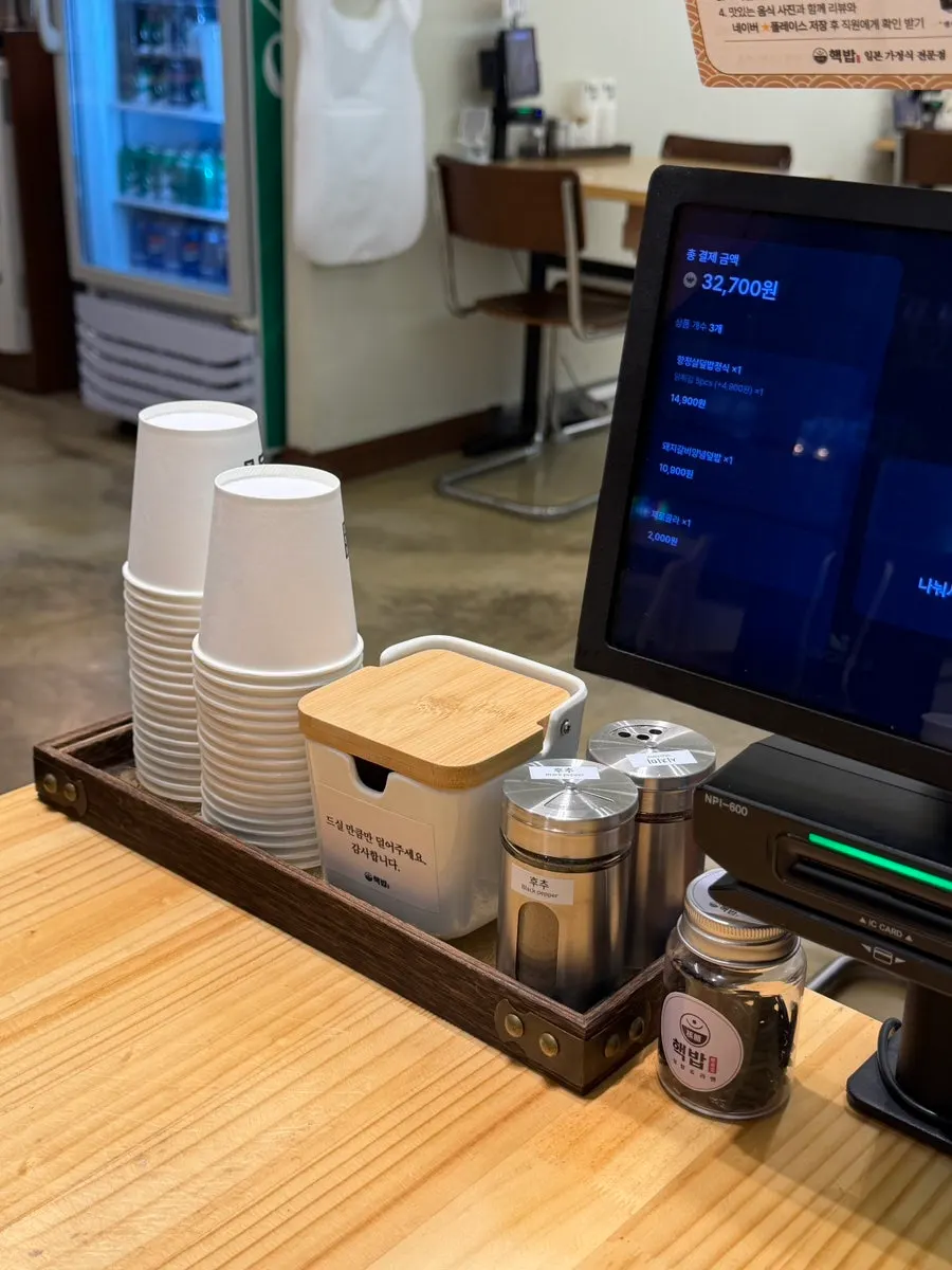 Pepper and shichimi, disposable wasabi, and hair ties on the table