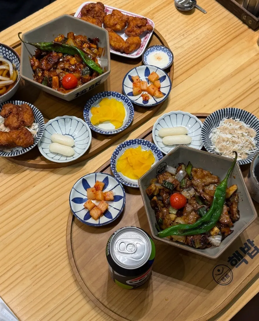 Table spread with the spicy pork rib rice bowl and pork jowl rice bowl set