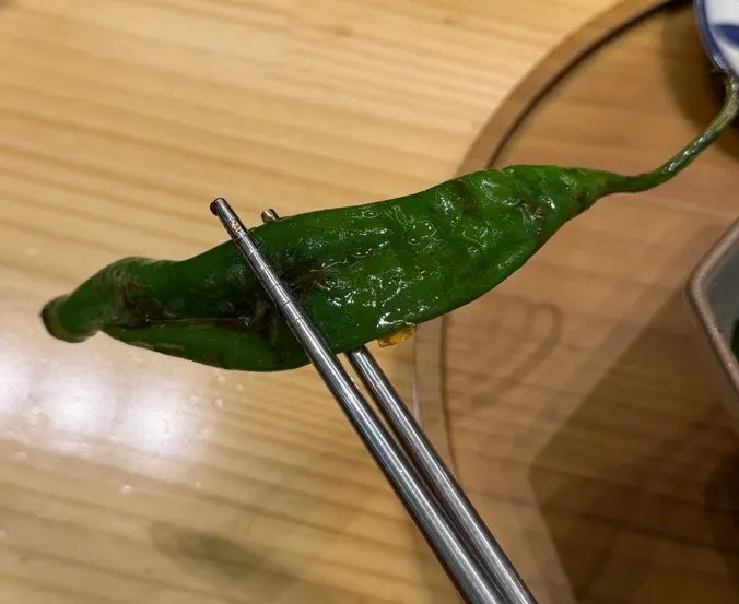Grilled shishito peppers as a topping on the rice bowl