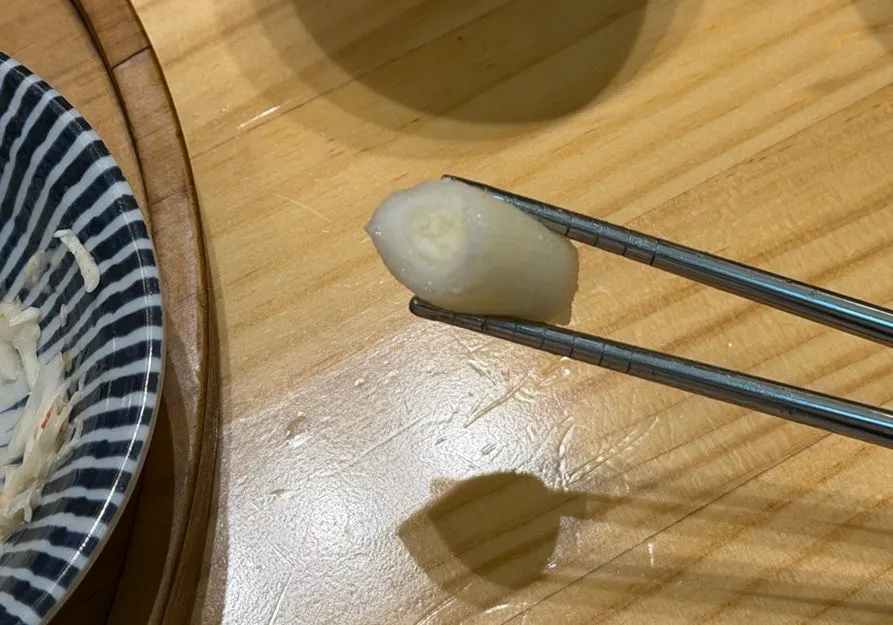 Cross-section of the chewy cheese rice cake drizzled with honey