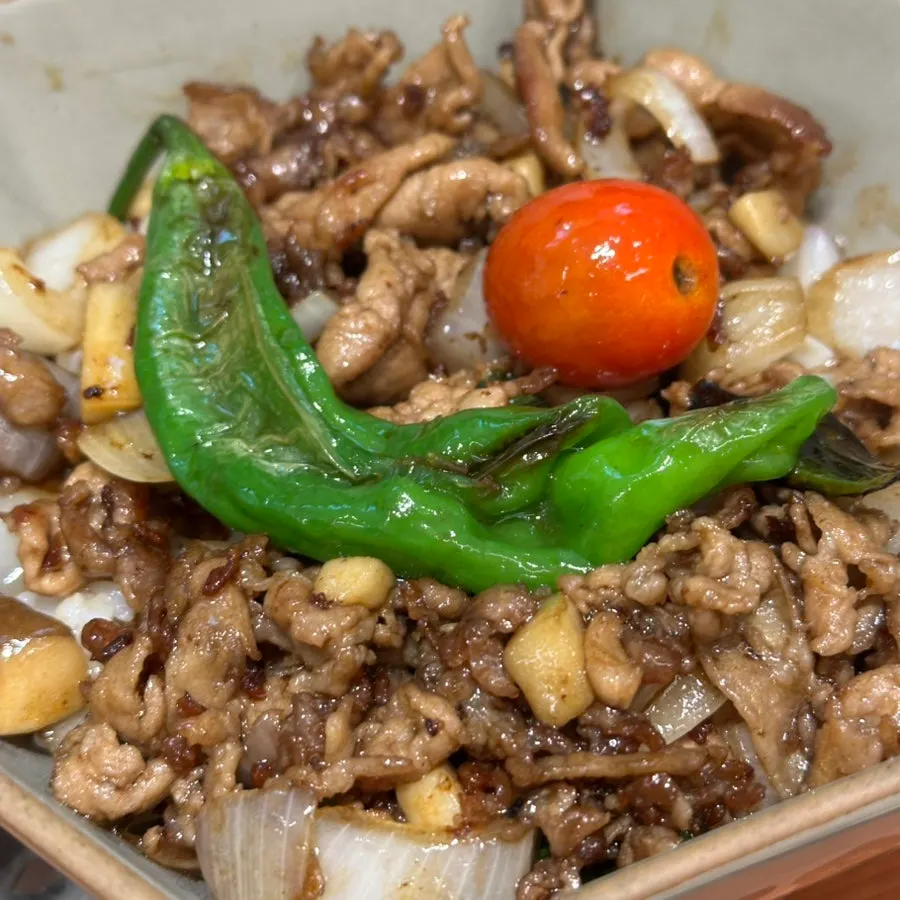 Meat-loaded rice bowl topped generously with pork shoulder