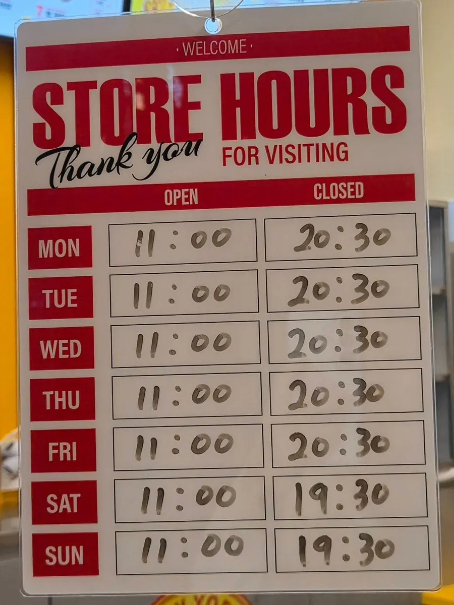 Business hours signage at Zilhal Bros Sangam