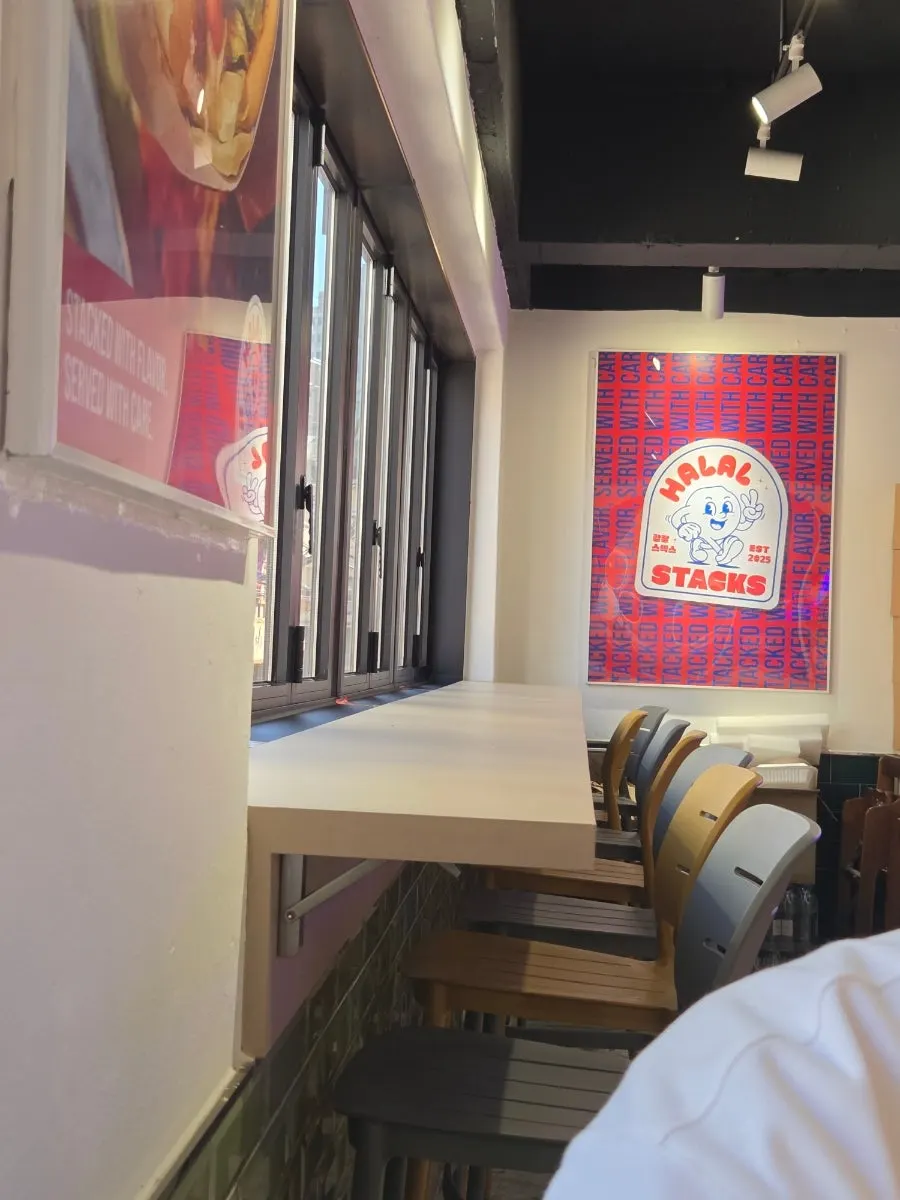 Interior of Halal Steaks with red tables and chairs